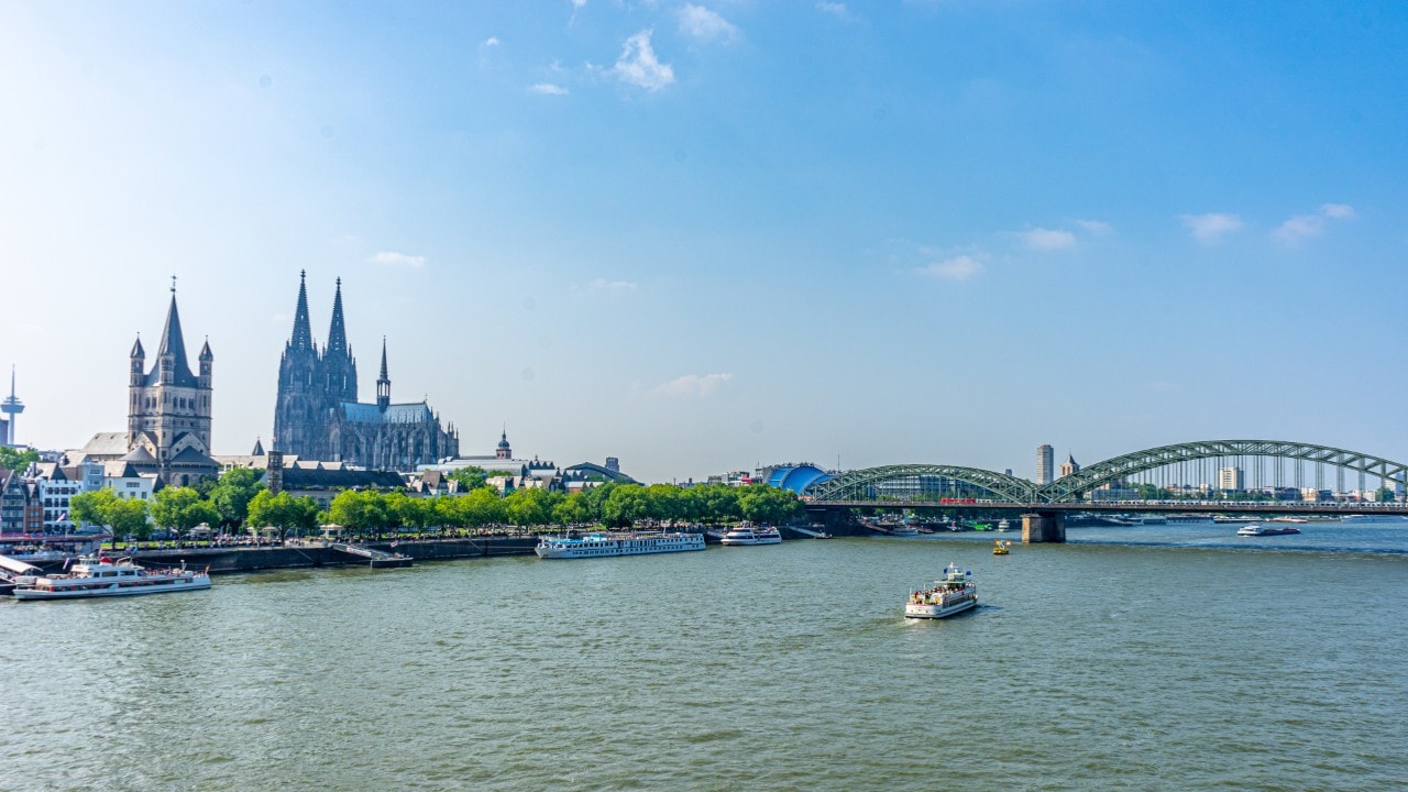 A beautiful view of the Cologne Cathedral in Germany behind the river
