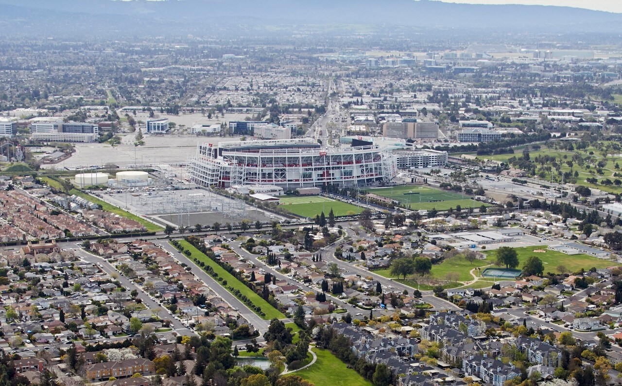 Aerial photography view west of Levi's Stadium, Santa Clara in the San Francisco Bay Area. The picture includes Renaissance, Ulistac Natural Area and Santa Clara Youth Soccer Park. CA 95134. San Francisco, California, United States.